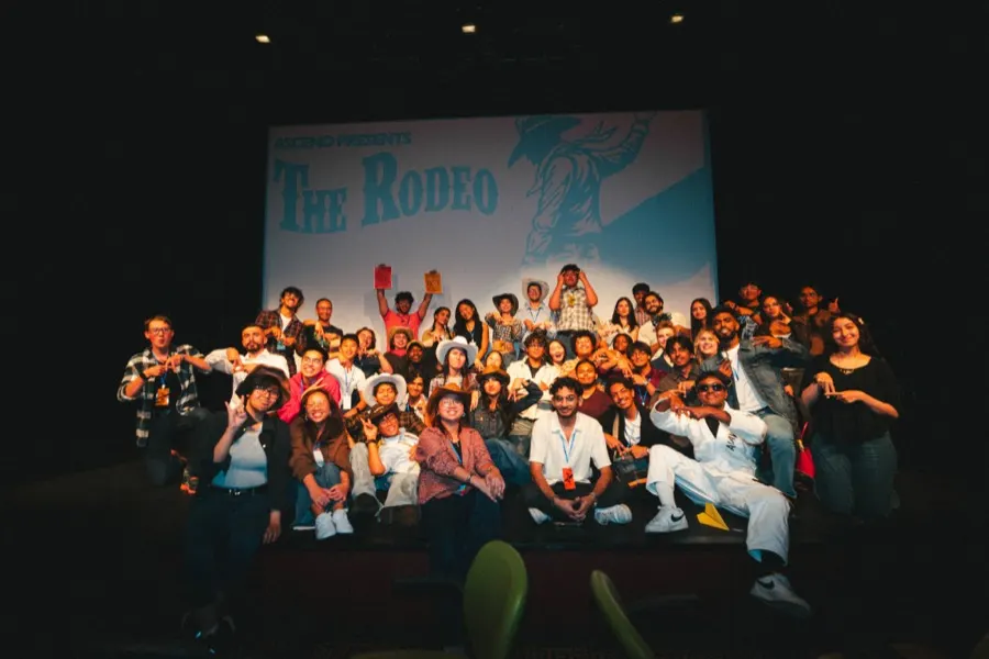 A full room photographed in front of the stage screen.